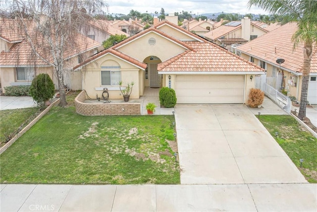 view of front of property with a garage and a front lawn