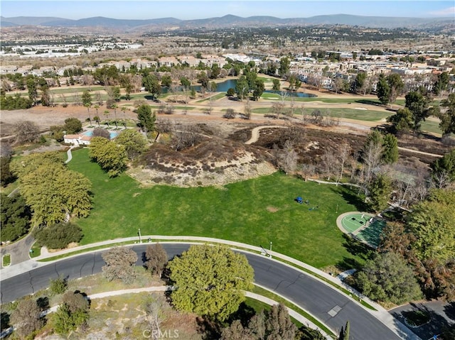 birds eye view of property with a mountain view