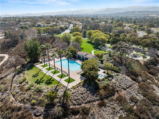 birds eye view of property with a mountain view