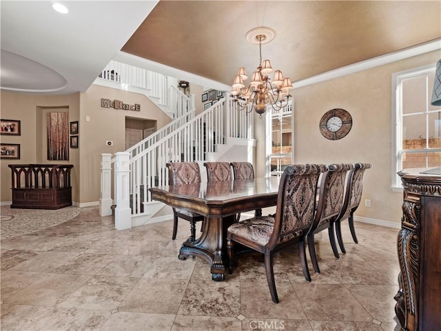 dining area with an inviting chandelier