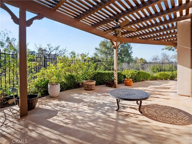 view of patio / terrace with ceiling fan and a pergola