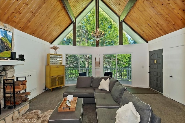 carpeted living room with a stone fireplace, high vaulted ceiling, beam ceiling, and wooden ceiling