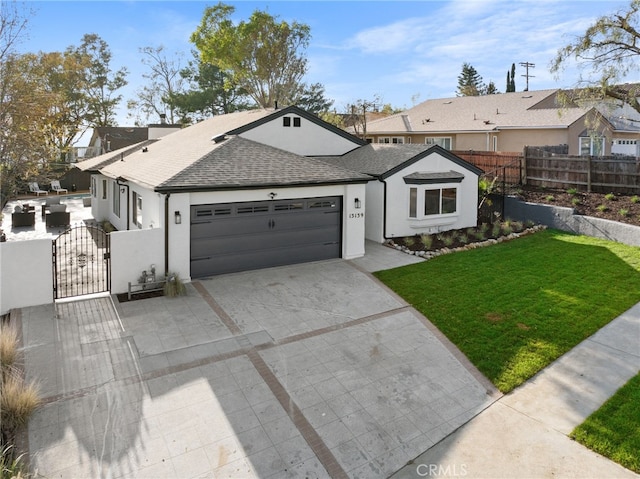 single story home featuring a garage and a front yard