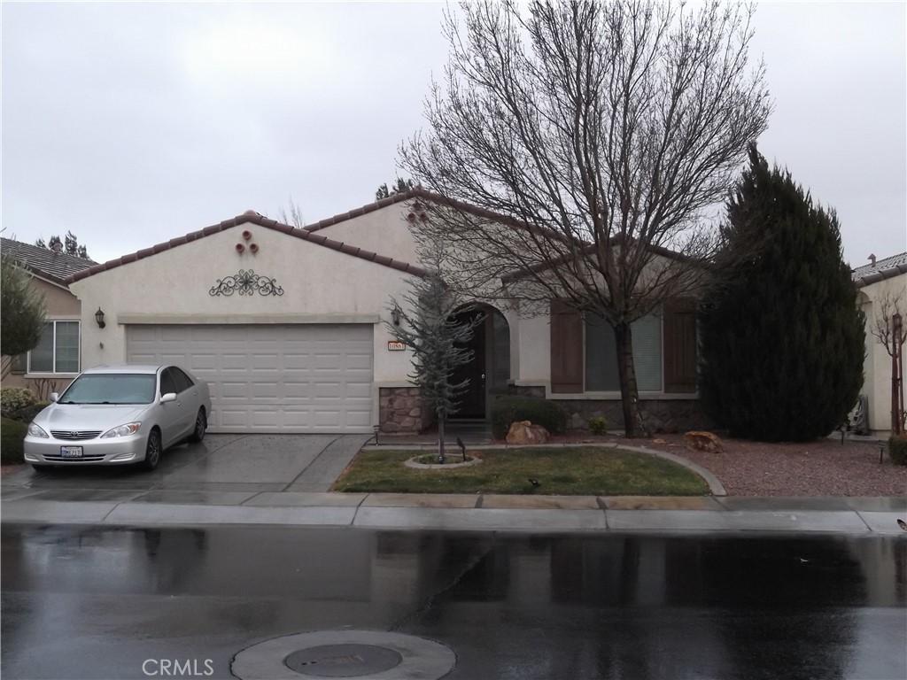 single story home with a garage