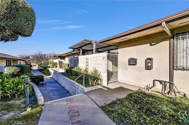 view of side of property with a patio area