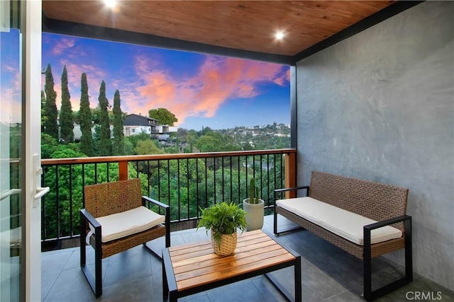 view of balcony at dusk