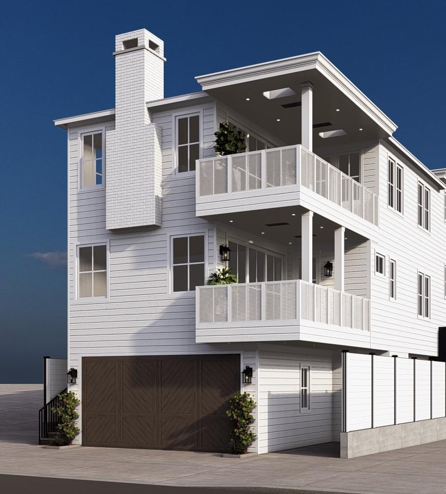 rear view of property with a garage and a balcony