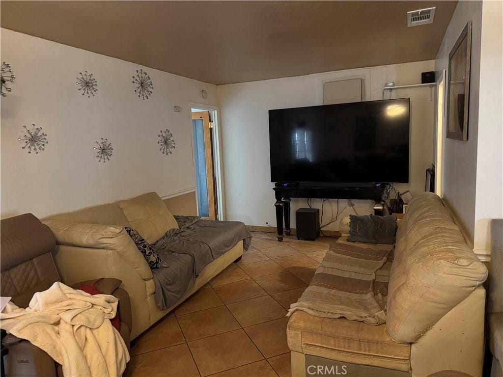 living room with light tile patterned floors