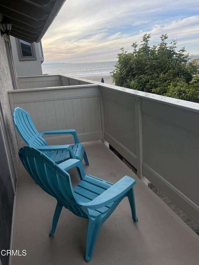 balcony featuring a water view