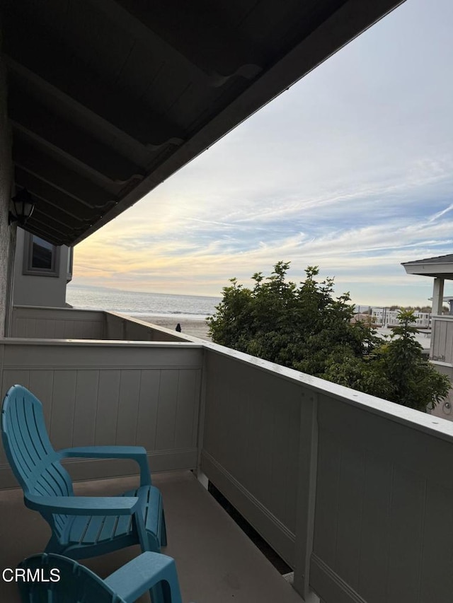 balcony at dusk with a water view