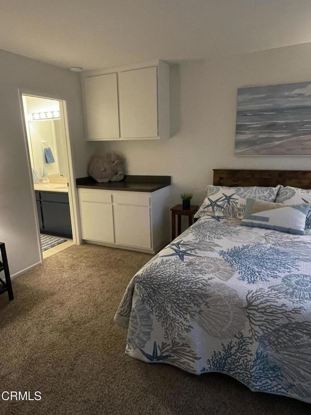 bedroom featuring carpet flooring and ensuite bath