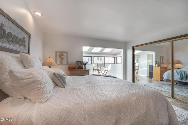 bedroom with a closet and light wood-type flooring