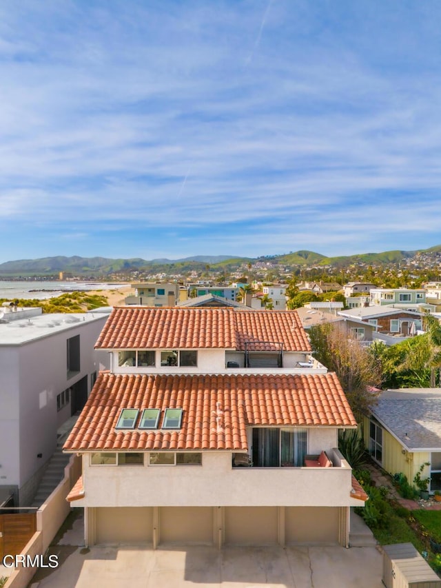 view of property with a residential view and a mountain view