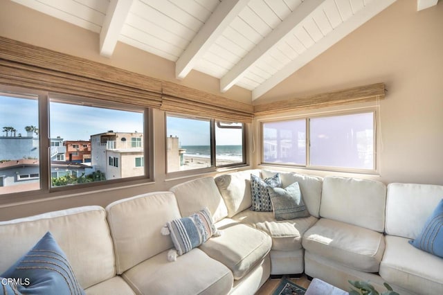 living room with wooden ceiling, a water view, and vaulted ceiling with beams