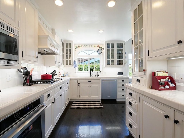 17 Barkentine Rd, Rancho Palos Verdes, CA 90275 - kitchen with stainless steel appliances, white cabinetry, dark hardwood / wood-style floors, and backsplash