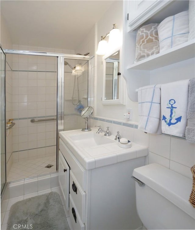17 Barkentine Rd, Rancho Palos Verdes, CA 90275 - bathroom with tile walls, vanity, tasteful backsplash, toilet, and walk in shower