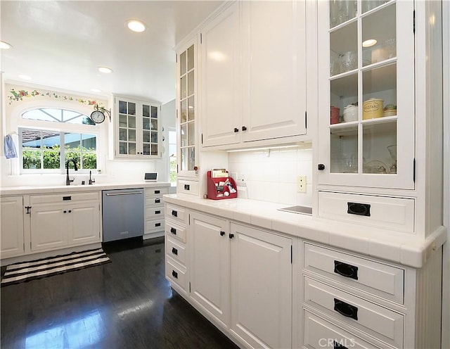 17 Barkentine Rd, Rancho Palos Verdes, CA 90275 - kitchen with dishwasher, white cabinetry, dark hardwood / wood-style flooring, decorative backsplash, and tile countertops