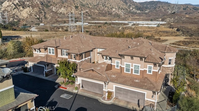 drone / aerial view featuring a mountain view