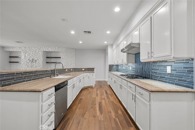 kitchen featuring white cabinetry, appliances with stainless steel finishes, sink, and backsplash