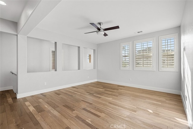 empty room featuring ceiling fan and light wood-type flooring