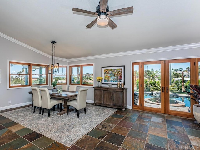 dining room featuring plenty of natural light, ornamental molding, and vaulted ceiling