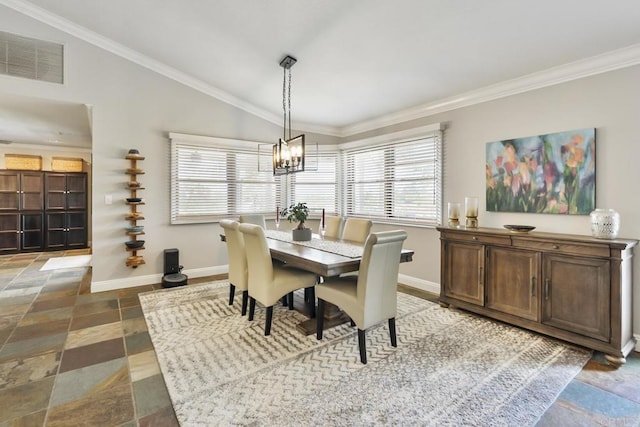 dining area featuring crown molding, lofted ceiling, and a notable chandelier