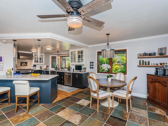 dining space featuring ceiling fan, ornamental molding, and plenty of natural light