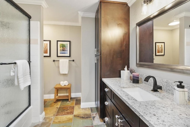 bathroom featuring crown molding, vanity, and shower / bath combination with glass door