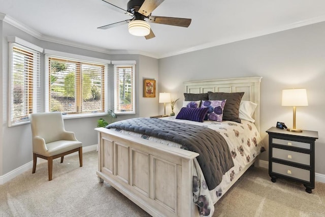 carpeted bedroom featuring ornamental molding and ceiling fan