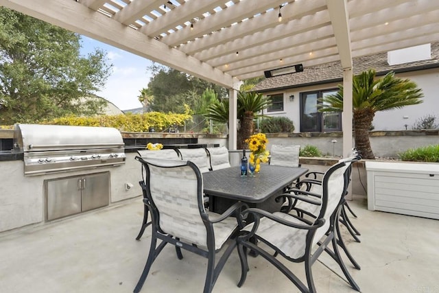 view of patio with an outdoor kitchen, a grill, and a pergola