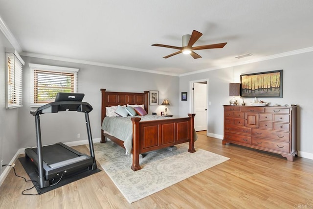 bedroom featuring ornamental molding, ceiling fan, and light wood-type flooring