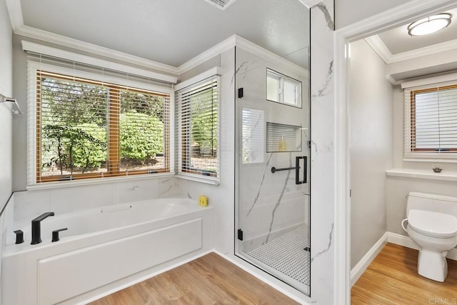 bathroom featuring crown molding, wood-type flooring, a healthy amount of sunlight, and plus walk in shower