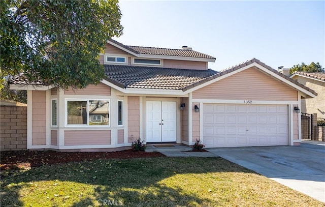 front facade featuring a garage and a front yard