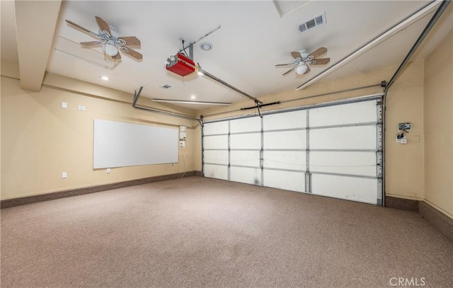 garage featuring a garage door opener and ceiling fan