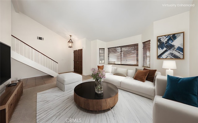 living room featuring vaulted ceiling