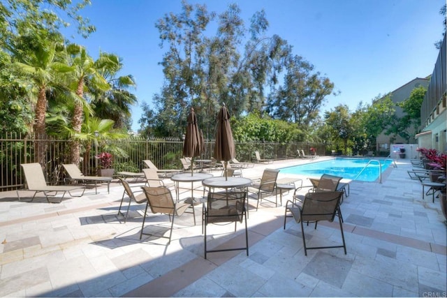 view of swimming pool featuring a patio