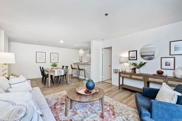 living room with light hardwood / wood-style flooring