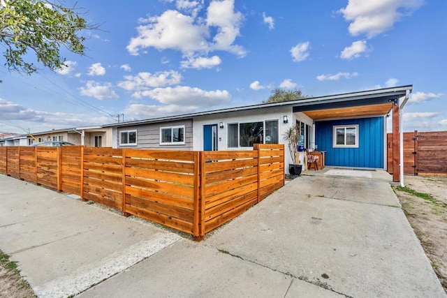 view of front of property featuring a carport