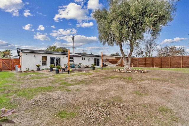 rear view of house with a patio