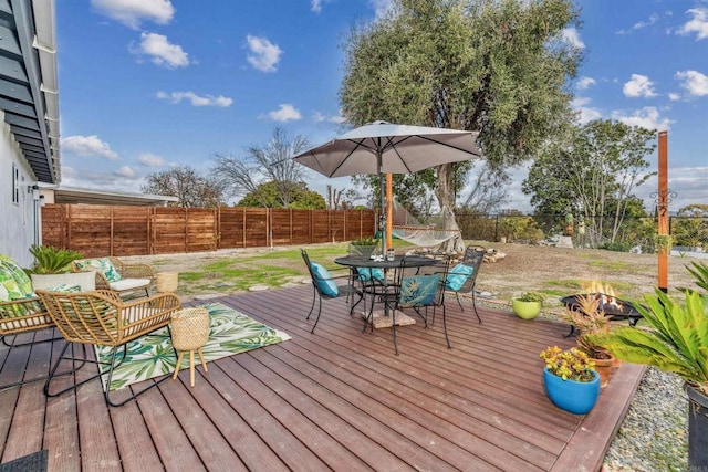 deck featuring an outdoor fire pit