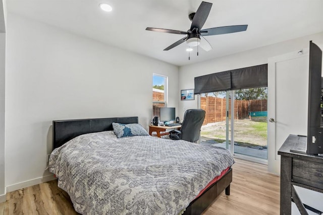 bedroom with access to exterior, ceiling fan, and light wood-type flooring