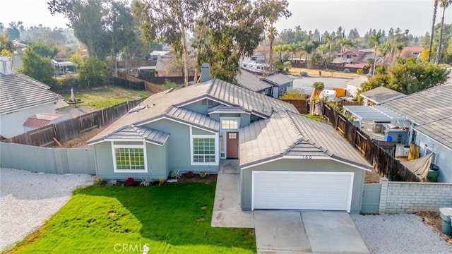 view of front of property with a garage and a front yard