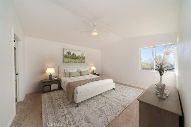 bedroom featuring lofted ceiling, light carpet, and ceiling fan