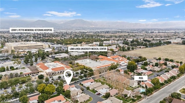 drone / aerial view featuring a mountain view