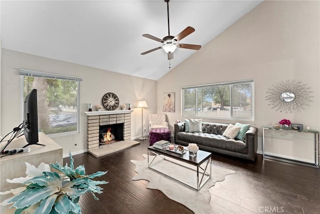 living room featuring a fireplace, high vaulted ceiling, dark hardwood / wood-style floors, and ceiling fan