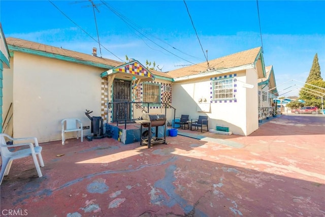 back of house with a patio area