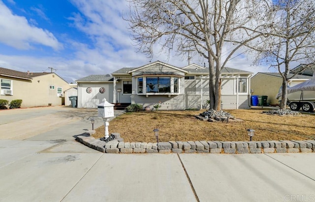 view of front of house with concrete driveway