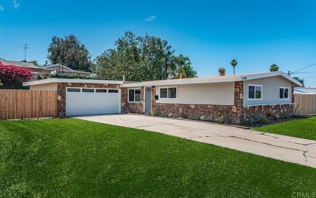 single story home with a garage and a front lawn