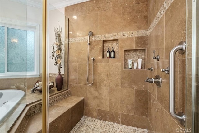 bathroom featuring independent shower and bath and ornamental molding