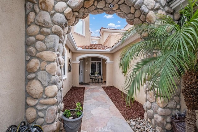 entrance to property with a patio